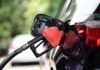 Fuel nozzle inserted into a car's gas tank