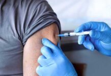 Healthcare worker giving an arm injection