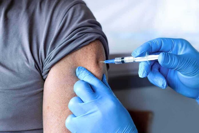 Healthcare worker giving an arm injection