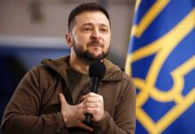 Ukraine Splits Alerts—Russia’s Mixed Barrage Forces Drastic Shift man holding a microphone with hand on chest