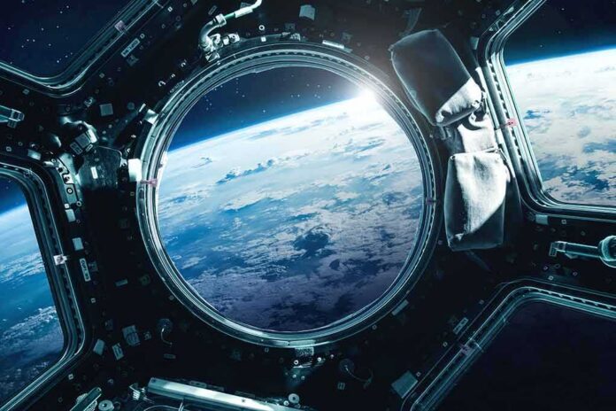 shutterstock_691137475 Earth seen through a spacecraft window