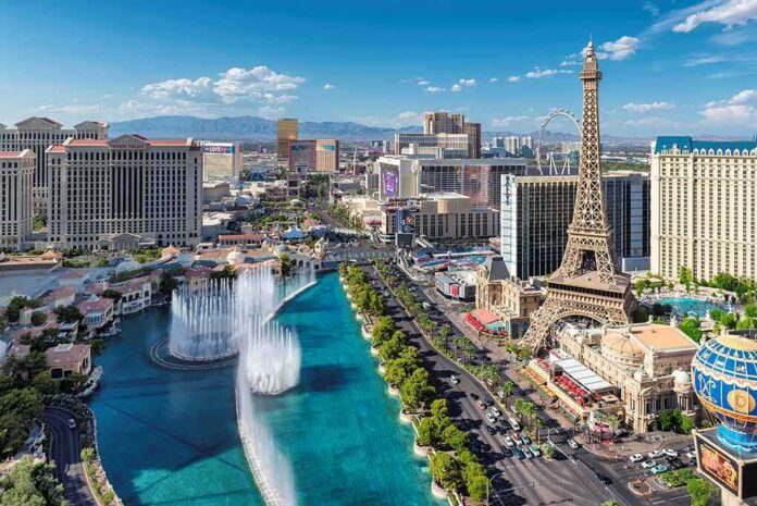 shutterstock_708501844 Las Vegas Strip skyline with fountains and Eiffel Tower replica