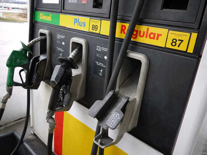 70780636 Gas station pumps for diesel, plus, and regular fuel.
