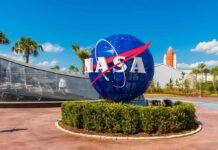 NASA Stakes Timeline – Will Seas Cooperate? NASA globe sign at visitor complex entrance