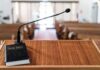 ‘Repent’ Over Privilege? Pulpit Clip Torches Campaign Podium with microphone and Bible in a church