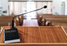 ‘Repent’ Over Privilege? Pulpit Clip Torches Campaign Podium with microphone and Bible in a church