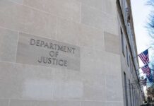 DOJ Unmasks Kremlin Hit Network Department of Justice building exterior with American flags