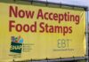 Feds Nab Governor’s Aide Over Food Cash Yellow banner announcing acceptance of food stamps and EBT