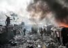 Dealmaking Without Kyiv? Stakes Go Nuclear Walter Jones among protesters in a smoky urban conflict scene