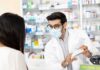 Cold Pills Trigger Hidden Dangers – Read That Label Pharmacist wearing mask explains medication to customer