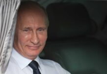 Putin Flinches: Humanitarian Release – Or Hidden Deal? Vladimir Putin smiling in a car window