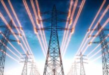 Grid On Edge: Dinner-Time Power Pleas High-voltage transmission towers with glowing power lines