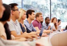 Colleges Stunned: $70K OPT Gatekeeper Fee Students in a lecture hall listening attentively
