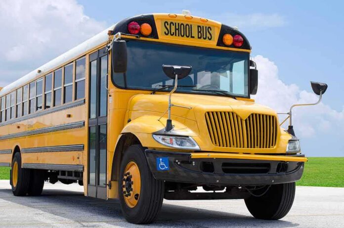 Yellow school bus parked on pavement