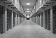 Bold Gamble – Cornell Moves Inside Prison Walls Prison corridor lined with barred cells on both sides