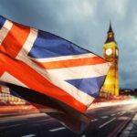 UK Shock: Plot Against Farage Exposed Union Jack flag waving with clock tower in London at dusk