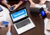 Meta’s Privacy Promises Backfire – Smacked With $25B Laptop with Facebook on screen surrounded by smartphones
